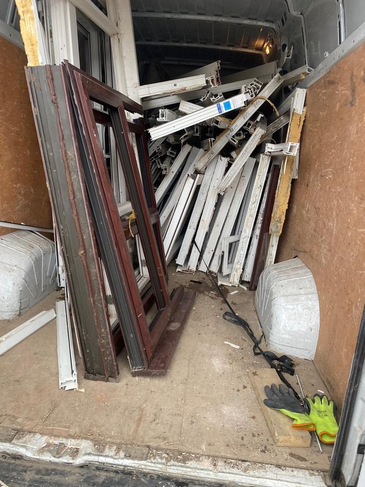 Mixed-colour uPVC frames inside a collection van